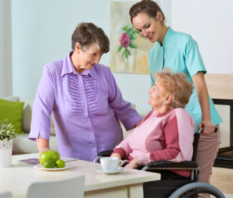 a caregiver talking with her patients