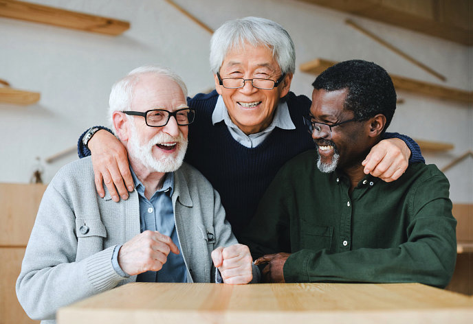 a group of senior men laughing